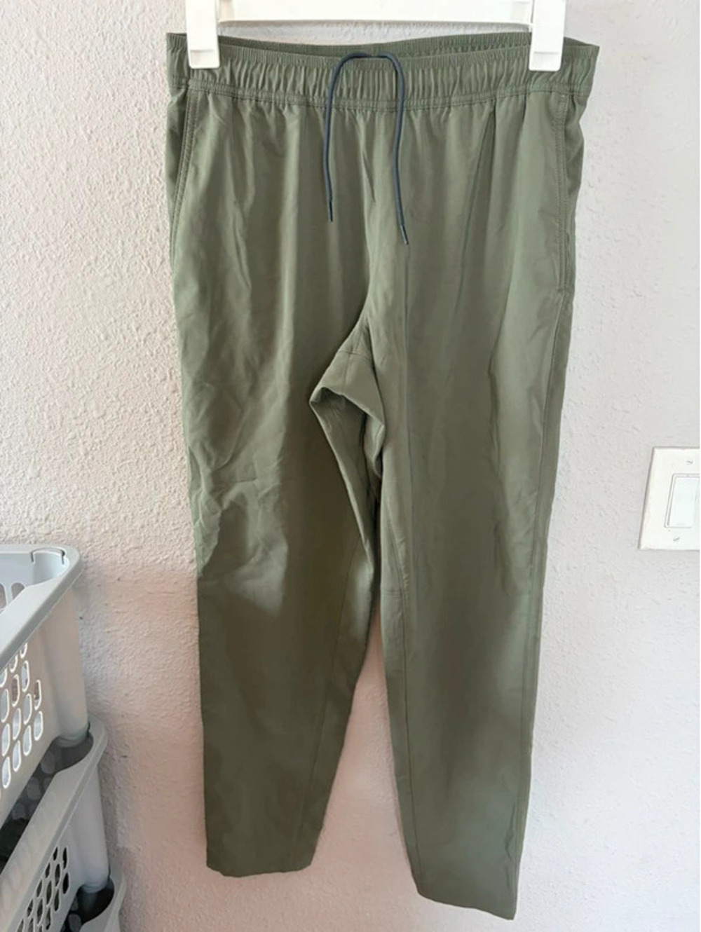 Men's Eddie Bauer green pants size M. 30.5in inseam. Mark on front